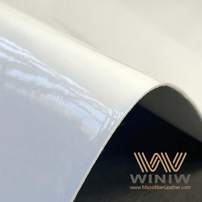 WINIWの堅い繊維のフットボールのための白く総合的なMicrofiberの革